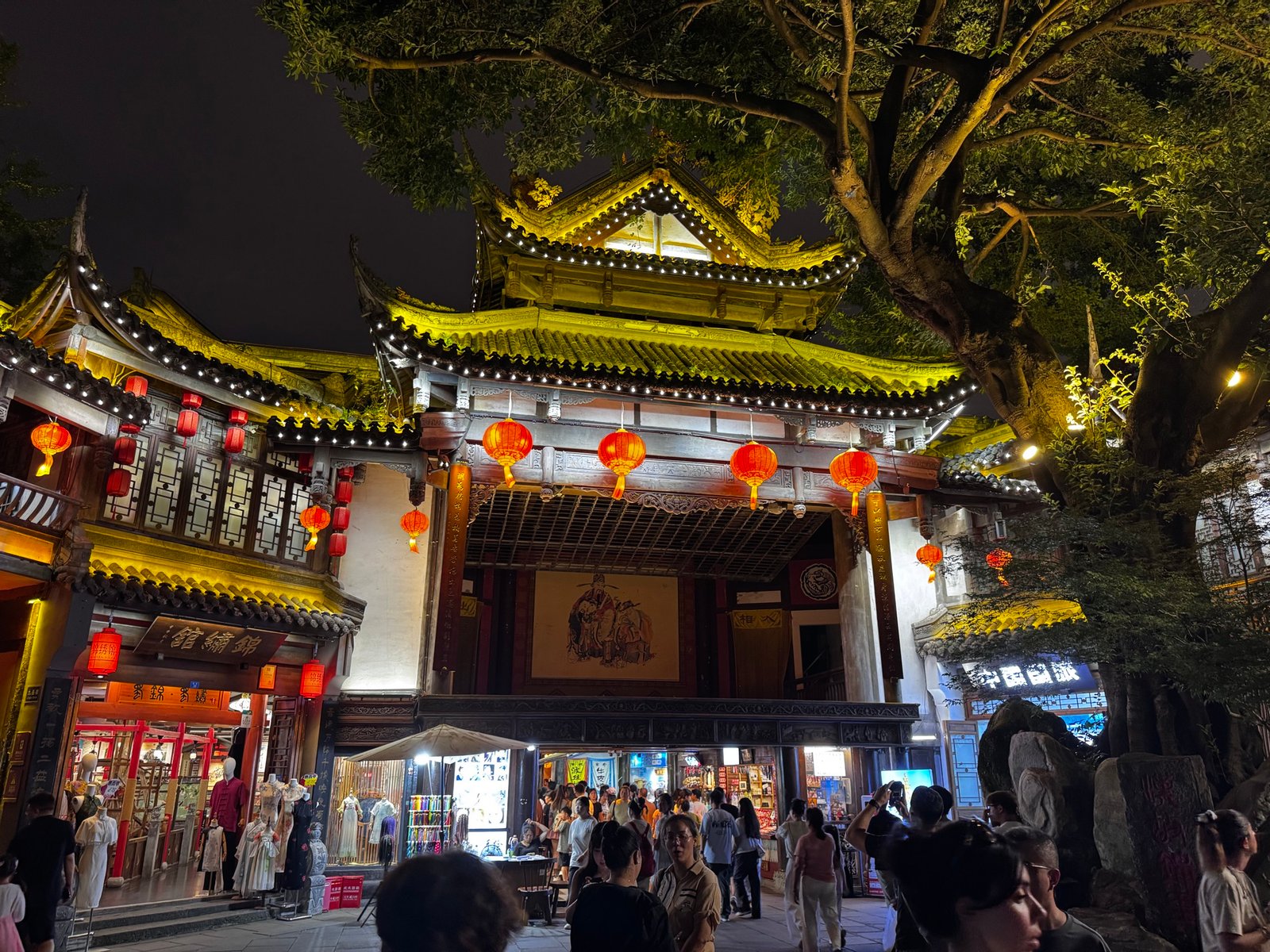 Traditional Chengdu architecture illuminated at night with red lanterns.